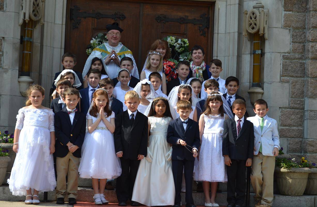 GREENSBORO — Students at Our Lady of Grace School receive their first Communion. (Photo provided by Aphton K. Lang)
