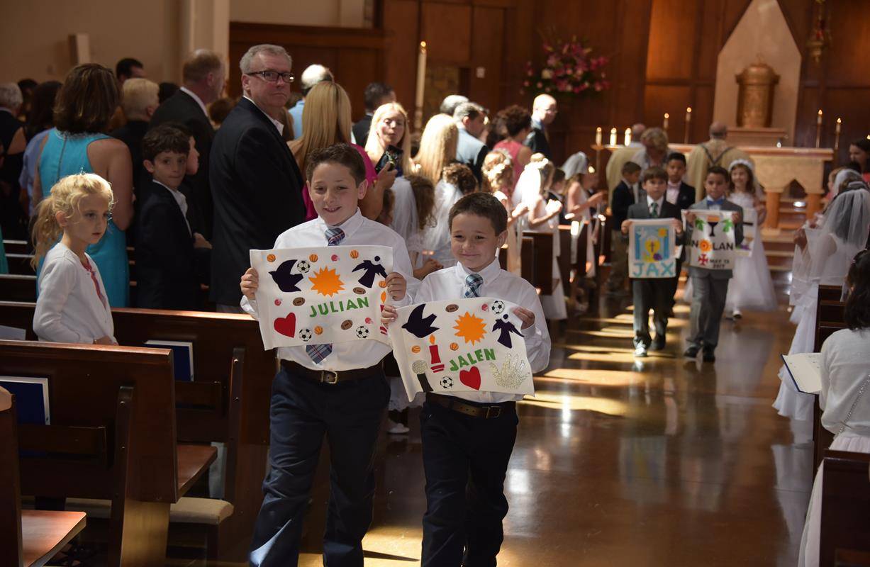 GREENSBORO — Youth at St. Pius X Church recently received the sacrament of first Holy Communion during Masses celebrated by Monsignor Anthony Marcaccio, pastor, and Monsignor Mauricio West, vicar general and chancellor of the Diocese of Charlotte. (Photos