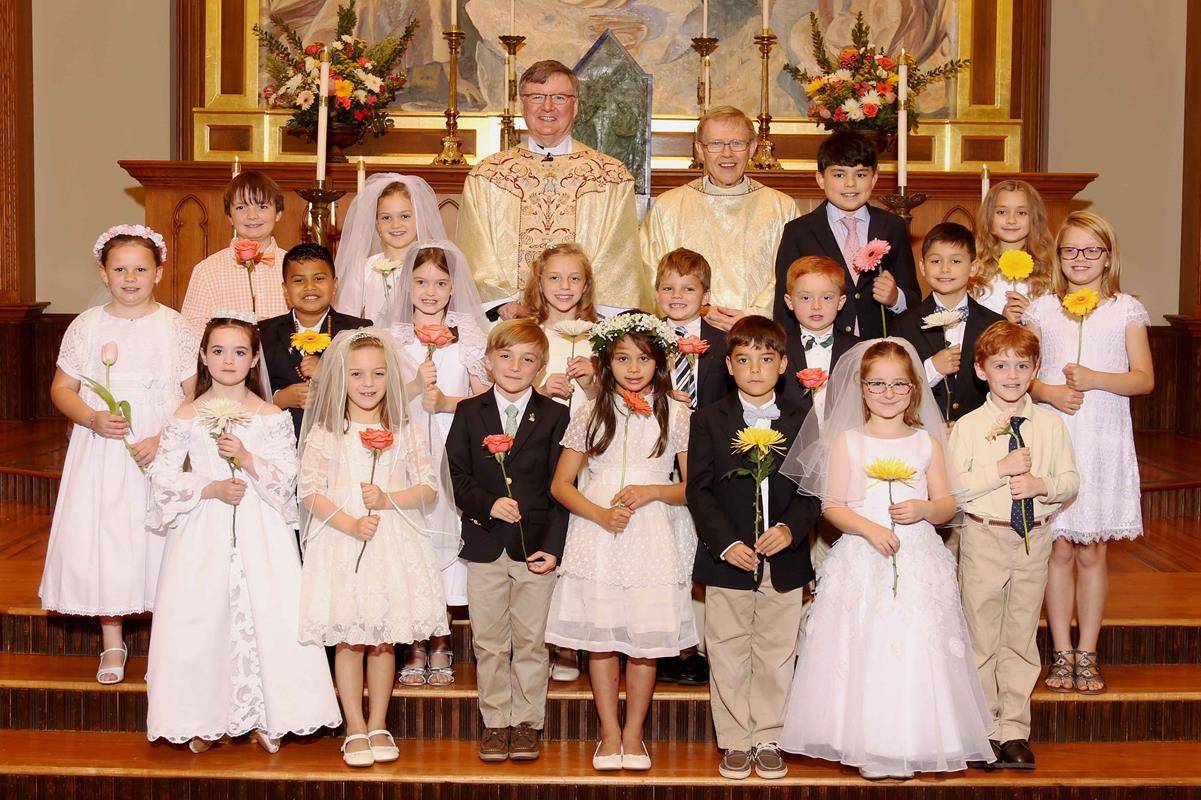 CHARLOTTE — Forty-two children received their first Communion at St. Peter Church May 6. (Photos by Eileen O'Neill)