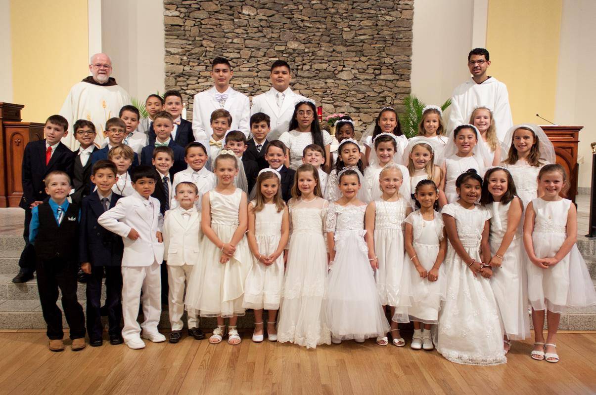 HENDERSONVILLE — Children at Immaculate Conception Church recently celebrated their first Holy Communion. (Photos provided by Capuchin Franciscan Father Martin Schratz)