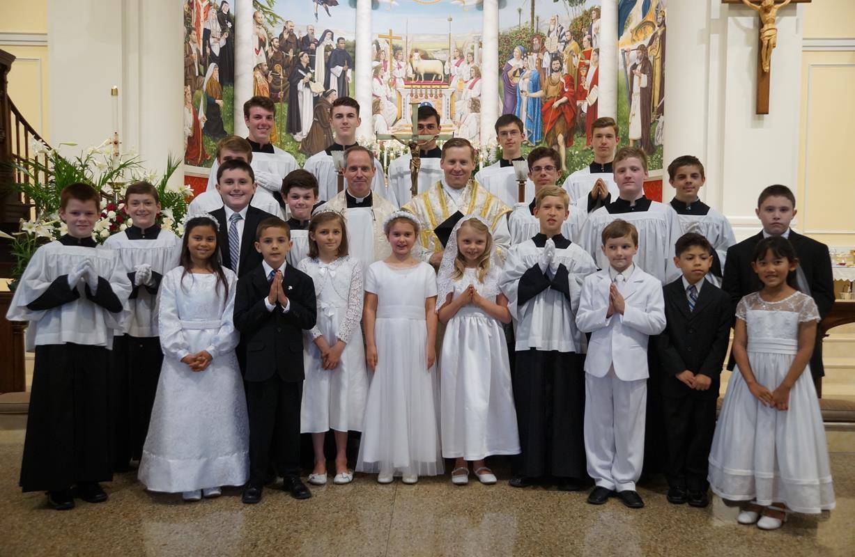 CHARLOTTE — Ten children at St. Ann Church received first Holy Communion April 30 during the parish’s regular Mass in the Extraordinary Form. Father Jason Barone, priest in residence, offered the High Mass, which was accompanied by the St. Ann Schola and