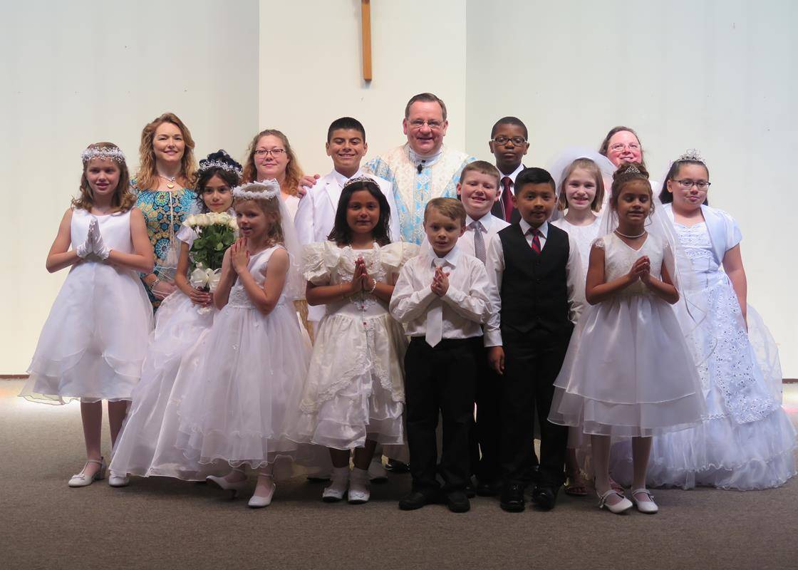STATESVILLE — Forty-seven children received their first Holy Communion May 7 at St. Philip the Apostle Church, during Mass offered by Father Thomas J. Kessler, pastor. At the conclusion of each Mass, the statue of the Blessed Virgin Mary was crowned by on
