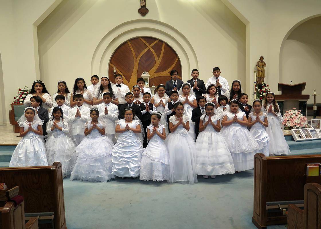 STATESVILLE — Forty-seven children received their first Holy Communion May 7 at St. Philip the Apostle Church, during Mass offered by Father Thomas J. Kessler, pastor. At the conclusion of each Mass, the statue of the Blessed Virgin Mary was crowned by on