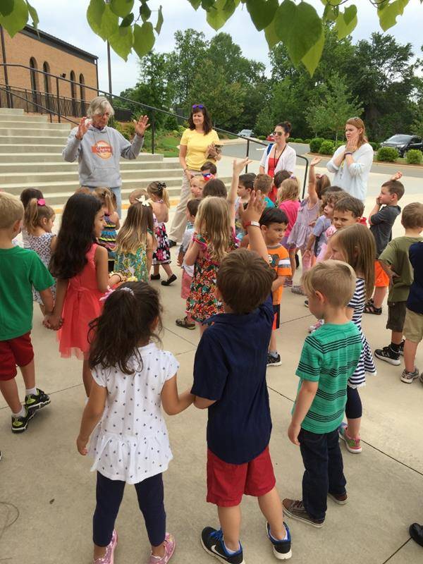 MOORESVILLE — Little Way Preschool at St. Therese Church celebrated May crowning with Father Don Ward on May 11th. (Photo provided by Lisa Cash)