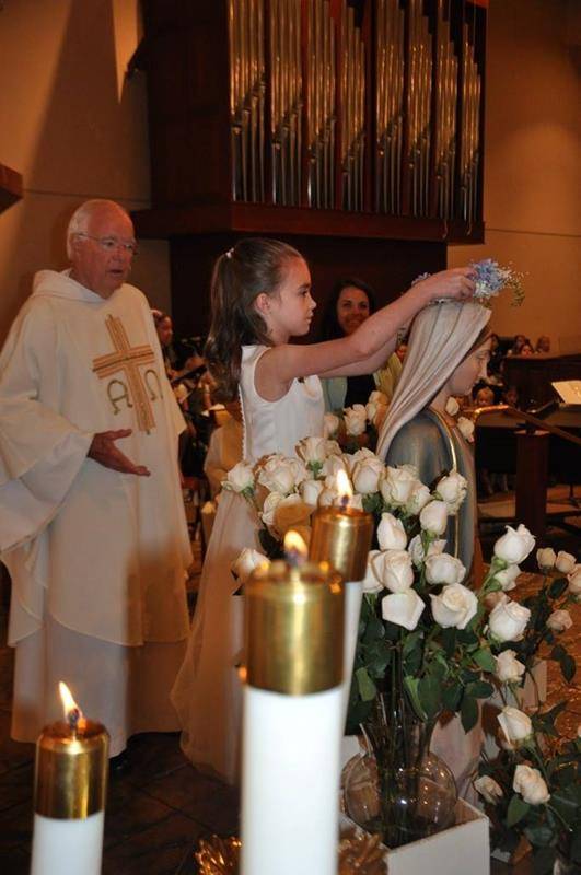 CHARLOTTE — Second grade students at St. Gabriel School wore their First Holy Communion outfits and crown our Blessed Mother May 17. The celebration was beautiful and reverent. (Photo via Facebook)